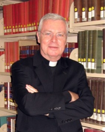 Paulist historian Father Paul G. Robichaud reads the spiritual notebook of Paulist Founder Father Isaac T. Hecker in the library of St. Paul's College in Washington, D.C.